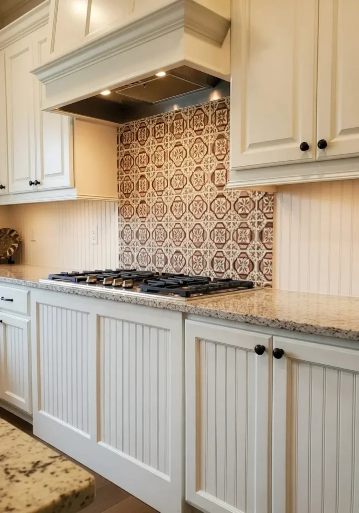 Beadboard backsplash combined with tile inserts for a layered kitchen design