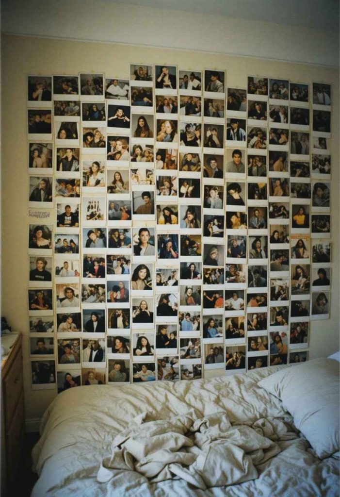 Grunge wall cluster of blurry disposable camera photo prints taped in overlapping layers